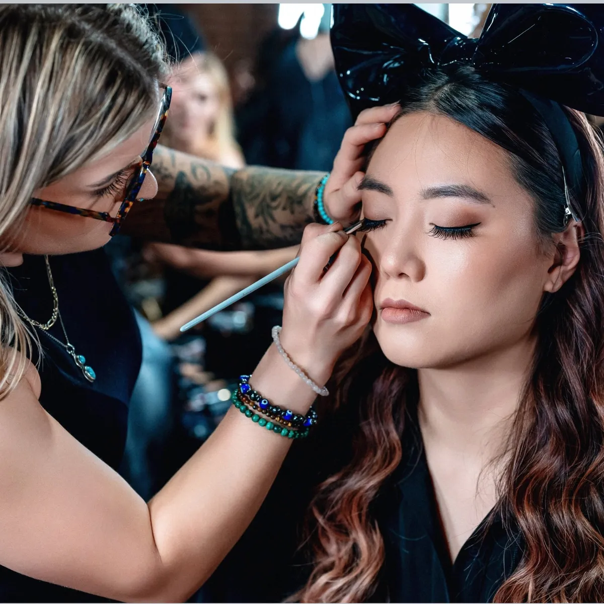 Anna Marie styling a client before a session